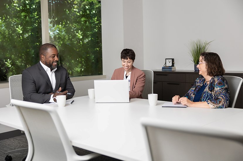 Tanenholz and Marr lawyers at conference table
