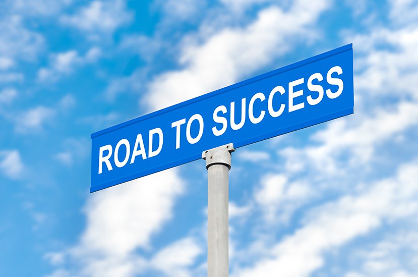 street sign reading road to success