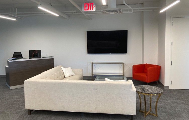 Reception desk and couch area at Tanenholz & Marr office at 11200 Rockville Pike.